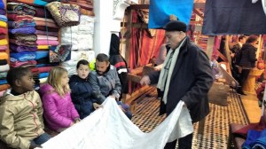 Soledad crew learning about sewing