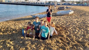 Liveaboard kids dream team playing in the sand
